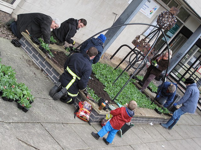 Volunteers replanting the flowerbed in 2013