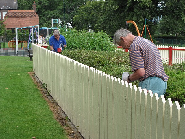 Painting the Infants Play Area fence
