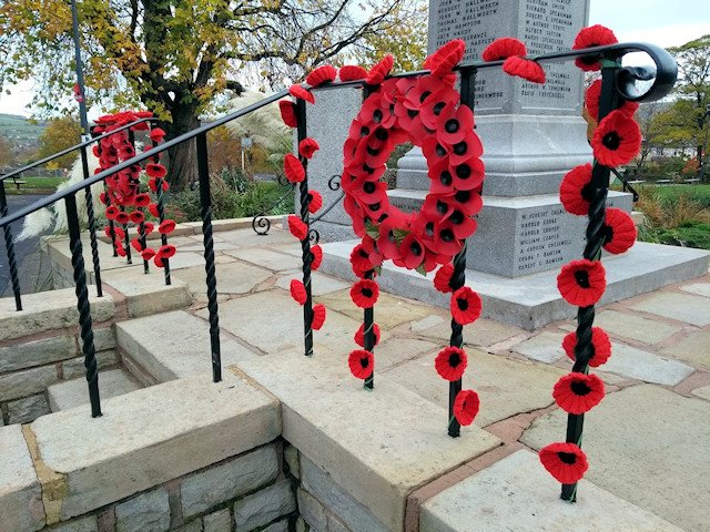 Knitted Poppies on the War Memorial